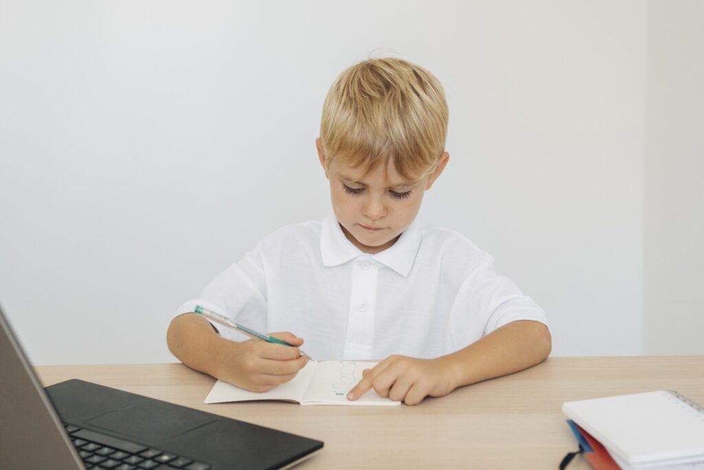 portrait-boy-paying-attention-online-class